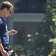 Mark Zuckerberg checks his phone during the annual Allen & Company Sun Valley Conference on July 13, 2018 in Sun Valley, Idaho.